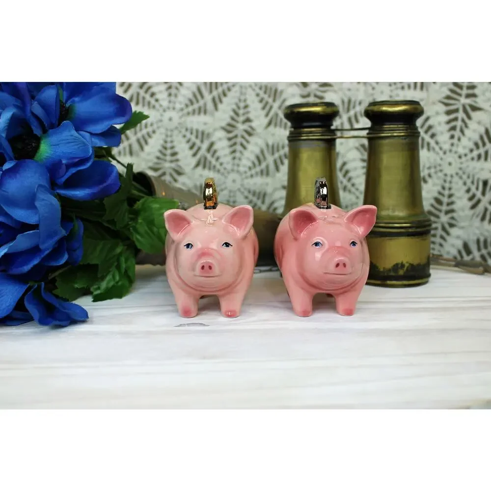 1999 Clay Art Pig Coins Salt and Pepper shakers.